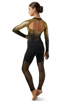 a woman in black and gold leotard with her back turned to the camera