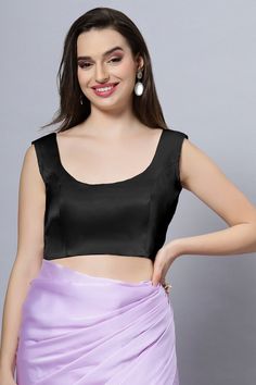 Our Satin Comfort Stretch collection blouses are made to impress and made to be worn all day. Made from the finest satin-cotton blend stretchable fabric, it holds its shape and shine while offering the comfort of stretchable material. Wear it with your favorite saree, as a crop top or lehenga choli! Item Type: Saree blouse / Crop top Product Features: Color: Black Fabric: Satin Stretch Trim: Back Dori Neck Style: U, Front & Back Sleeve Length: Sleeveless Closure: Back Hook Padded: No Occasion: F Bridesmaid Sarees, Reception Sarees, Tie Back Blouse, Blouse Crop Top, Formal Saree, Saree With Belt, Blouse Crop, Kalamkari Saree, Blouse Sleeveless