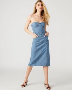 This denim dress combines the casual appeal of blue denim with the sophistication of a bustier top and pencil skirt. Perfect for a cocktail event or dinner out, the midi length offers just the right amount of coverage while still showing off your curves. Bustier denim midi dress Pencil skirt bottom Back zipper closure Length: 35.75" 98% cotton 2% spandex Hand wash Emma is 5ft 10in and is wearing a size small Imported Womens Denim Dress, Denim Midi Dress, Cocktail Event, Bustier Top, Denim Fabric, Midi Length, Denim Dress, Blue Denim, Pencil Skirt