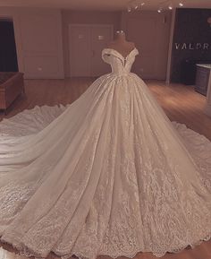 a wedding dress on display in a room