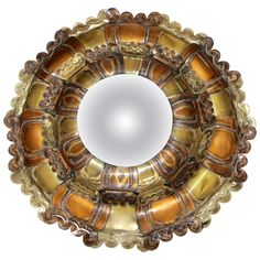 an image of a mirror that is in the shape of a flower ornament