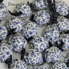 several blue and white balls with black bows