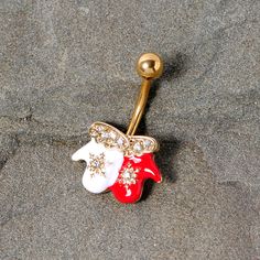 Clear Gem Gold Tone Winter Mittens Snowflake Christmas Belly Ring If you can't wait for the first snow day this holiday season then this 14 gauge Christmas belly button ring is right for you! made with a 10mm gold tone plated over 316L surgical grade stainless steel curved barbell, this navel ring features a red and white winter mittens charm complete with clear gem star details and clear gem liners along the top of the charm that makes the winter gloves look warm and fashionable too!Specificati The First Snow, Jewelry Promotion, Winter Mittens, Navel Ring, Belly Button Ring, Snowflake Christmas, First Snow, Winter Gloves, Button Ring