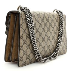 This is an authentic GUCCI GG Supreme Monogram Small Dionysus Shoulder Bag in Taupe. This stylish bag is crafted of Gucci GG monogram canvas. The shoulder bag features an aged silver chain shoulder strap and a textured horseshoe closure with tiger heads at the end. The press lock closure opens to a taupe suede lining and coated canvas zipper compartment. Gucci Bag Dionysus, Small Messenger Bag, Gg Monogram, Vintage Monogram, Gucci Shoulder Bag, Monogram Bag, Black Phone Case, The Press, Stylish Bag