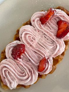 a dessert with strawberries and whipped cream on top