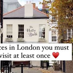 there is a sign that says places in london you must visit at least once on the street