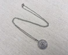 "This is a understated and elegant little boho disc pendant necklace. It is perfect for everyday wear and would go with just about anything. The disc measures 3/4\" long by 5/8\" wide and is made from allergy free plated silver. It hangs from a simple stainless steel necklace chain. I have matching earrings in my shop, if you would like the whole set. Here is the link https://etsy.me/2VZ551y Thanks for stopping by! Please take a moment and visit the rest of my Etsy shop. I have many more unique Silver Dainty Necklace For Festivals, Bohemian Silver Charm Necklace With Delicate Chain, Silver Delicate Chain Bohemian Jewelry, Bohemian Silver Jewelry With Delicate Chain, Silver Bohemian Jewelry With Delicate Chain, Bohemian Sterling Silver Charm Necklace With Adjustable Chain, Bohemian Jewelry With Delicate Chain, Bohemian Silver Necklace With Delicate Chain, Silver Bohemian Necklace With Delicate Chain