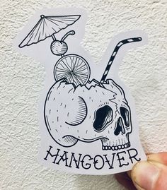 a sticker that says hangover with a skull holding an umbrella and a drink