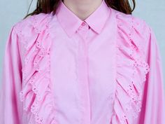 "AUNT GERTRUDE PRESENTS - vintage long sleeve pink shirt - frill at the front - materials: polyester CONDITION (1-10 ❶❷❸❹❺❻❼❽❾ Great condition SIZE/MEASUREMENTS size from label: 44 best fits: XL/XXL shoulder to shoulder: 16 inches (40 cm) bust: 44 inches (112 cm) length: 27 inches (68 cm) sleeve length from armpit: 18,5 inches (47 cm) The model is 5'9\" (174 cm), measures 35-27-38 (90-69-96 cm) and wears size M" Feminine Long Sleeve Ruffled Tops, Feminine Long Sleeve Ruffle Tops, Chic Long Sleeve Ruffled Shirt, Pink Long Sleeve Top With Ruffle Hem, Pink Ruffle Sleeve Top With Ruffles, Feminine Long Sleeve Shirt For Spring, Pink Long Sleeve Feminine Top, Feminine Pink Long Sleeve Top, Pink Fitted Top With Ruffled Collar