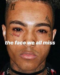 a man with tattoos on his face and the words, the face we all miss