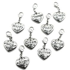 six charms with words and hearts on them