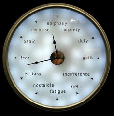 a clock with words written on the face