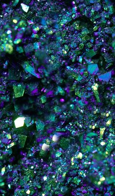 many small pieces of green and purple glitter