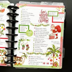 an open christmas planner with santa clause on it