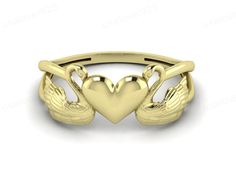 a gold ring with two hearts and wings