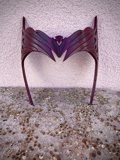 a purple chair sitting on top of a stone floor