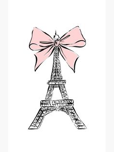 the eiffel tower with a pink bow on it