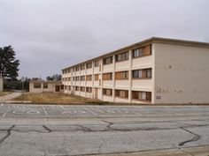 an empty parking lot in front of a building