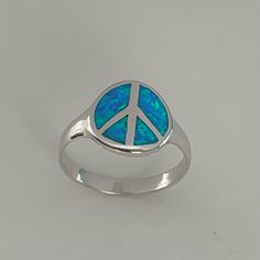 Sterling Silver Blue Lab Opal Peace Sign Ring, Hippie Ring, Love Ring, Religious Ring, Peace Ring, Boho Ring, Statement Ring, May Also Be Worn As A Midi Ring, Or As A Thumb Ring. 925 Stamped Freedom Or A Period Of Freedom From Public Disturbance Or War, A Quiet And Calm State Of Mind, Agreement And Harmony Among People, Peace Sign Family Love Silver Boho, Friendship Loyalty Statement Love Can Be Worn Multiple Fingers, Midi Ring, Toe Ring. Perfect Gift Idea For Any Occasion: Birthday, Anniversary Adjustable Symbolic Blue Rings, Symbolic Adjustable Blue Rings, Symbolic Blue Round Rings, Peace Sign Ring, Peace Ring, Hippie Ring, Hippie Rings, Ring Opal, Midi Ring