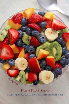 fresh fruit salad with blueberries, bananas, kiwis and strawberries