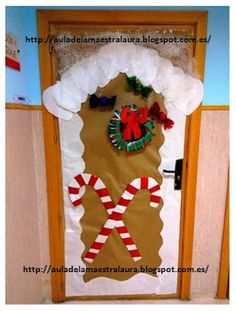 a door decorated with candy canes and christmas decorations