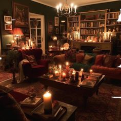 a living room filled with lots of furniture and candles