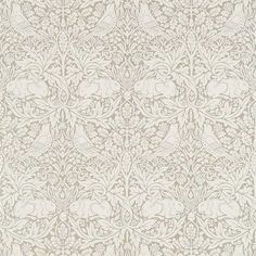 an ornate wallpaper with white flowers and leaves