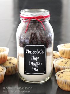 chocolate chip muffin mix in a glass jar next to cupcakes