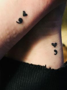 two people with matching tattoos on their wrist