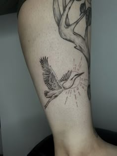 a tattoo on the leg of a woman with a deer head and antelope