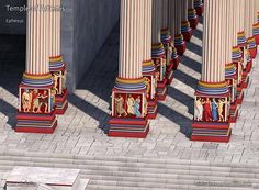 the columns are painted with different colors and designs