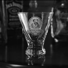 an empty glass sitting on top of a table