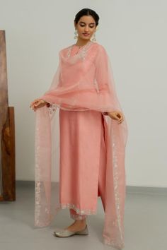 Blush pink chanderi silk kurta with zardosi hand embroidered cuffs and hemline. Comes with pant and a silk organza dupatta.
Components: 3
Pattern: Hand embroidered
Type Of Work: Zardosi
Neckline: Round
Sleeve Type: Full
Fabric: Chanderi silk, Dupatta : Silk organza
Color: Pink
Other Details: 
Closure : Kurta - Front button
Disclaimer : The product will dispose off some color, since it is hand dyed.
Occasion: Sangeet - Aza Fashions Wedding Outfits Indian, Flared Anarkali, Salmon Peach, Ethereal Elegance, Kurta Pant Set, Silk Kurta, Stylish Blouse Design, Pink Suit, Boutique Dress Designs