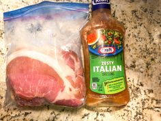 raw meat and seasoning are sitting on the counter next to an open plastic bag