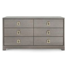 a grey dresser with gold handles and drawers