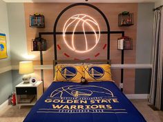 a bed room with a neatly made bed and a neon sign on the wall above it