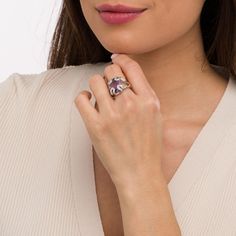 Plan to stand out when you wear this distinct purple amethyst and diamond accent folded ribbon ring - an intoxicating look that makes your unique taste known. Crafted in sterling silver This choice showcases a 16.0 x 12.0mm oval-shaped bright purple amethyst. Diamond-accented and beaded ribbons fold over at the corners of the center stone, creating an eye-catching sculpted frame. The inside of the split shank is rounded for comfort. Elegant Purple Birthstone Ring With Gemstone Accents, Elegant Purple Ruby Ring With Accent Stones, Elegant Multi-stone Amethyst Promise Ring, Elegant Multi-stone Amethyst Ring Gift, Elegant Amethyst Open Birthstone Ring, Elegant Purple Birthstone Ring With Open Design, Elegant Amethyst Birthstone Open Ring, Elegant Open Amethyst Birthstone Ring, Elegant Purple Birthstone Open Ring