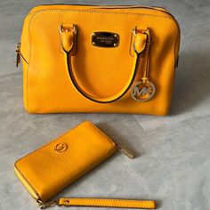 Michael Kors Nwot Vibrant Goldenrod Color Satchel /Crossbody Strap & Wallet Satchel Crossbody Bag Purse & Wallet Golden Rod Mustard Beautiful Color Great For Year Around Use Saffiano Leather Pvc Bag Care Guide Included Wallet Is Genuine Leather 2 Satchel Handles / Approx. 4.5” Drop Adjustable And Removable Crossbody Strap Included Gold Tone Accents Front Has Round Mk Hangtag Gold Tone, Designer, Nameplate Back Has Slip Pocket Between Handles Inside Is Fully Lined In Tan Designer Imprinted Fabric Yellow Michael Kors Travel Bag, Michael Kors Yellow Shopping Bag, Goldenrod Color, Pvc Bag, Golden Rod, Crossbody Strap, Michael Kors Bag, Purse Wallet, Inside Pocket