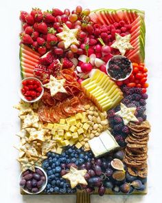 a platter filled with fruit and crackers