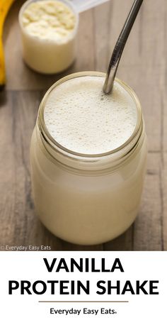 a glass jar filled with white liquid next to a banana