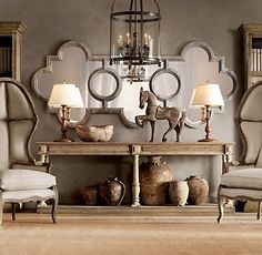 a living room filled with furniture and bookshelves