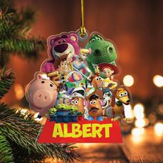 an ornament hanging from a christmas tree with the word albert in front of it