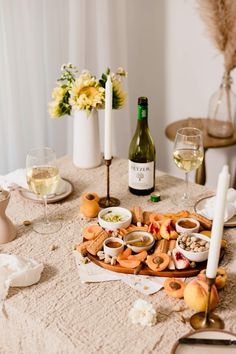 an assortment of food and wine on a table