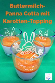 three small glasses with carrots in them on a green background and the words buttermilch - panna cota mit karoten - topping