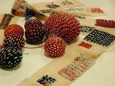 several pieces of cloth with polka dots on them sitting on a table next to each other