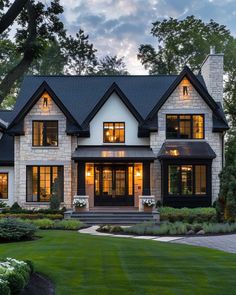 a large white and black house with lots of windows