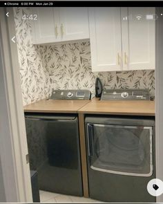 an image of a kitchen setting with washer and dryer