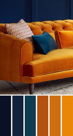 an orange couch with blue walls and pillows