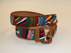 These beautiful colorful belts are a combination of genuine leather and Mayan Indian weaves from the village of Totonicapán, Guatemala. This is a great choice for both men and women and would make a stunning addition to any wardrobe. The belts are 100% artisan made. Due to the natural state of the leather and handcrafted nature, there may be a slight variation with each belt including the weave color and pattern.  **HOW TO ORDER SIZE** These sizes are not the same as U.S. standard sizes. To be sure you are ordering the correct size, please see our instruction page on our photos. Choice of 8 lengths Artisan handmade Natural leather combined with Mayan weaving Adjustable Artisan Multicolor Belt, Adjustable Handmade Multicolor Belt, Artisan Multicolor Fabric Belt, Vintage Adjustable Multicolor Belts, Casual Brown Woven Belt, Casual Multicolor Adjustable Belt, Casual Multicolor Fabric Belt, Multicolor Embroidered Leather Belt, Adjustable Multicolor Leather Belts