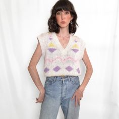 This playful novelty knit sweater from 80s era is giving artsy scandi style meets retro soft girl. Made by Open Road  from a soft fuzzy & loose knit white ramie acrylic blend this short sleeve knit features a whimsical playful geometric print of butter yellow, lavender and pink, triangles, diamonds, and zig zag squiggles. Love the relaxed and boxy fit with sharp cap sleeves and preppy rib knit v neckline. The perfect knit for dainty femme Spring looks! FIT  Large Length 21"  Bust 19" MODEL: 5'2" Novelty Sweater, 80s Era, Butter Yellow, Loose Knit, Scandi Style, Pullover Sweater Women, Open Road, Spring Looks, Soft Girl